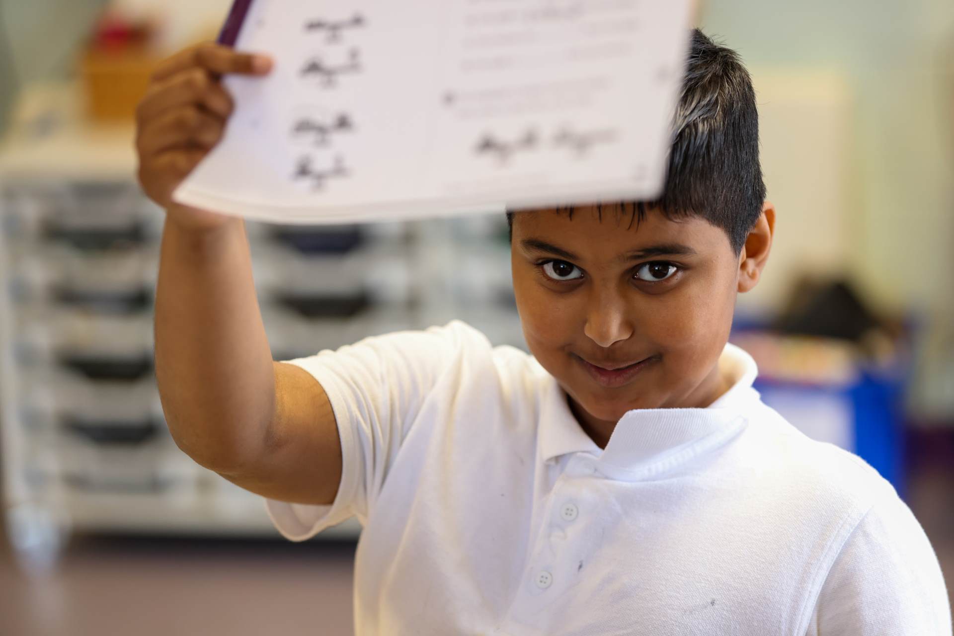 child holding work